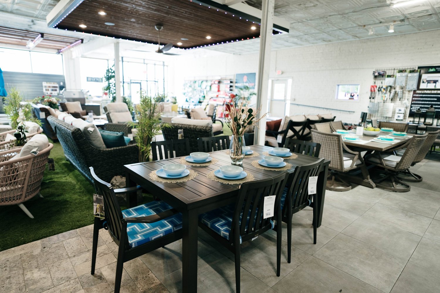 Showroom displays of outdoor dining and lounge furniture