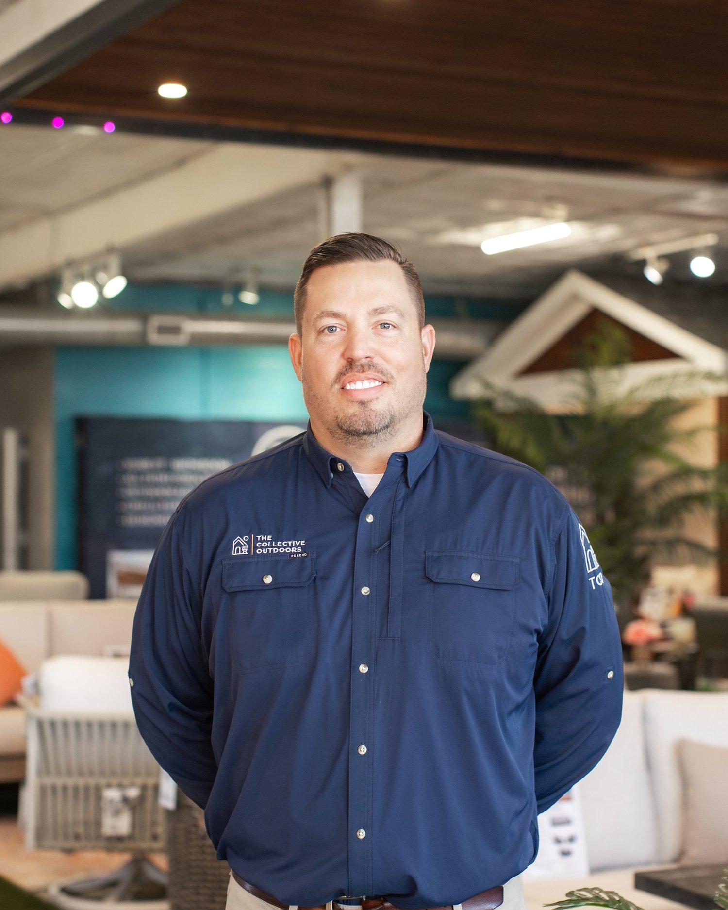 Portrait of Dustin Hillman in the showroom