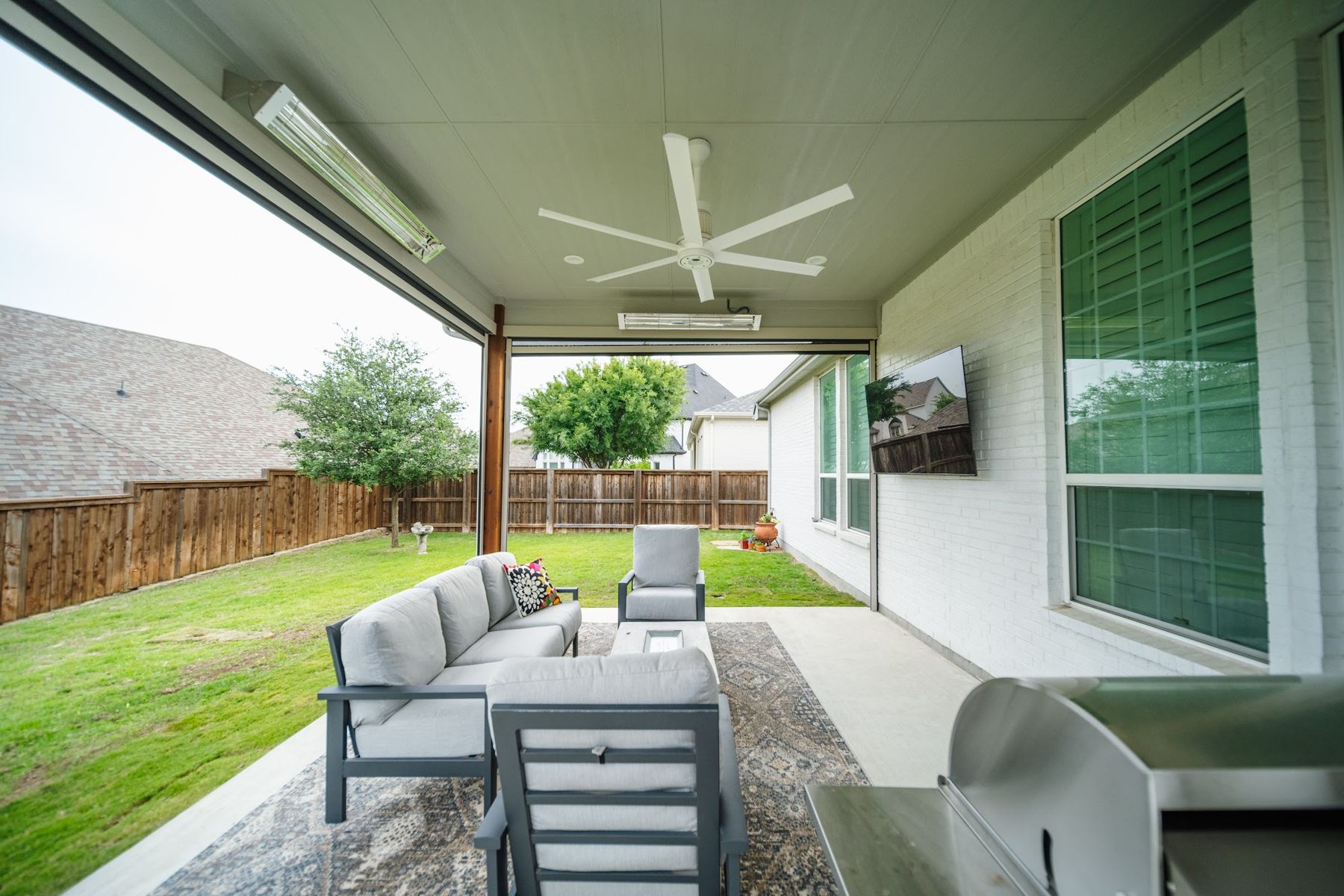 Covered patio with lounge set, ceiling fan and heaters, Aledo