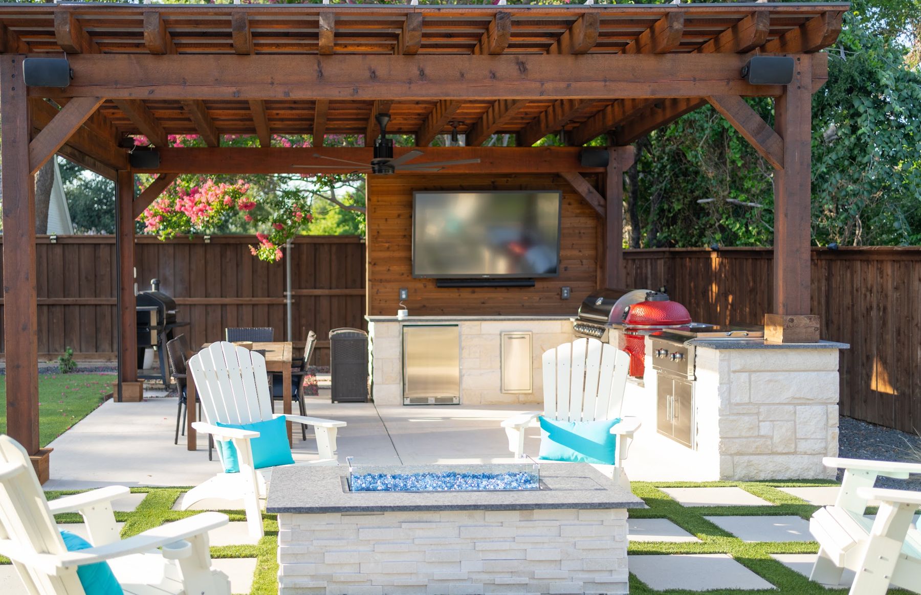 Pergola with fire table, Adirondack chairs and turf joints, Benbrook