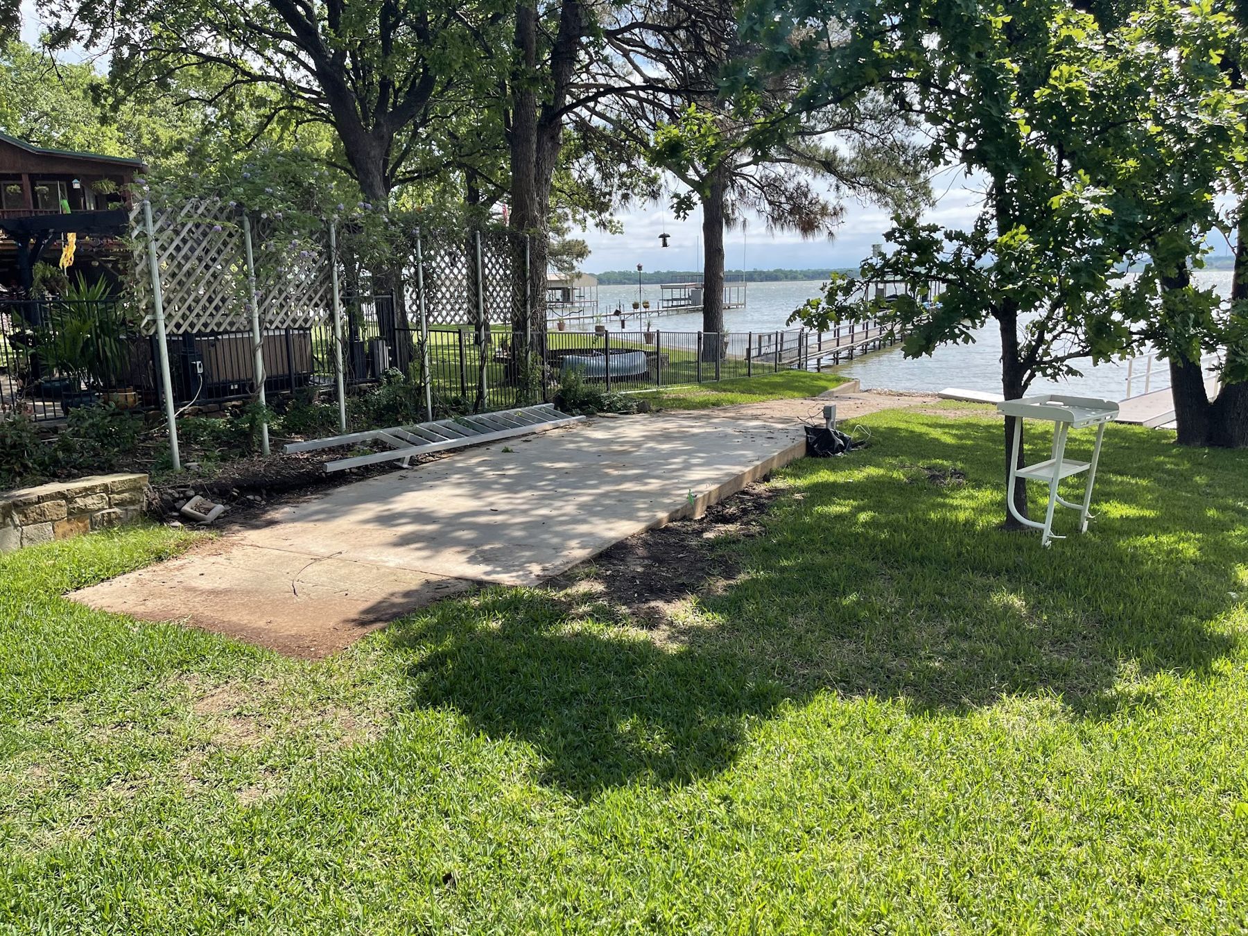 Open lawn and old slab at the lakefront before construction